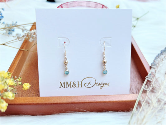 Gold Bead and Aquamarine Blue Cubic Zirconia Charm Earrings